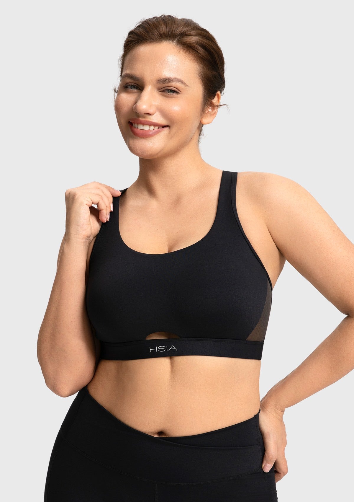 Black medium impact yoga bra showing full coverage and flattering V-neck design