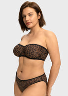 Side profile showing secure lift of the black leopard strapless bra for bigger chest