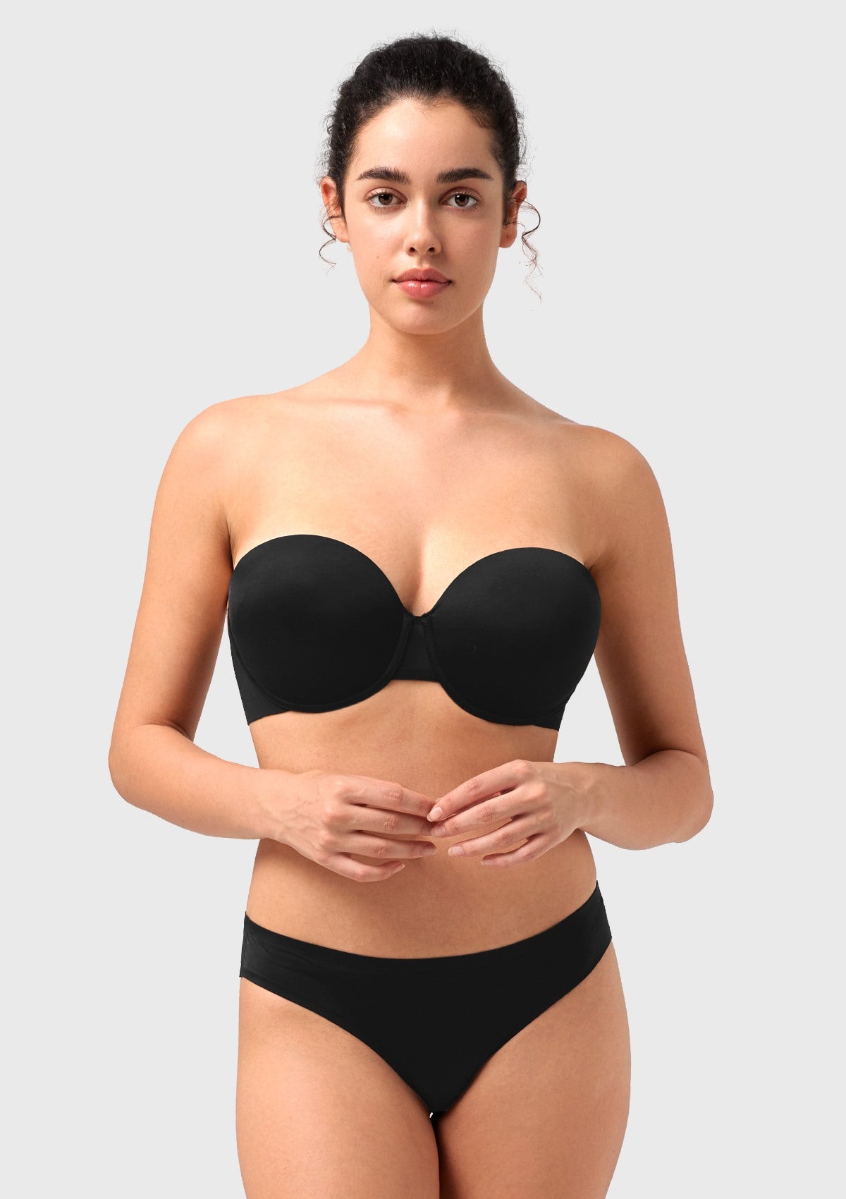 Front view of the black seamless push-up strapless bra, providing an elegant and invisible lift perfect for evening wear and party dresses.
