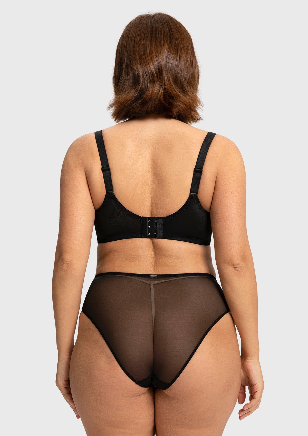 Back view of the black plus size lace bra, showing the secure multi-row hook closure that intentionally scales up for bounce-free stability.