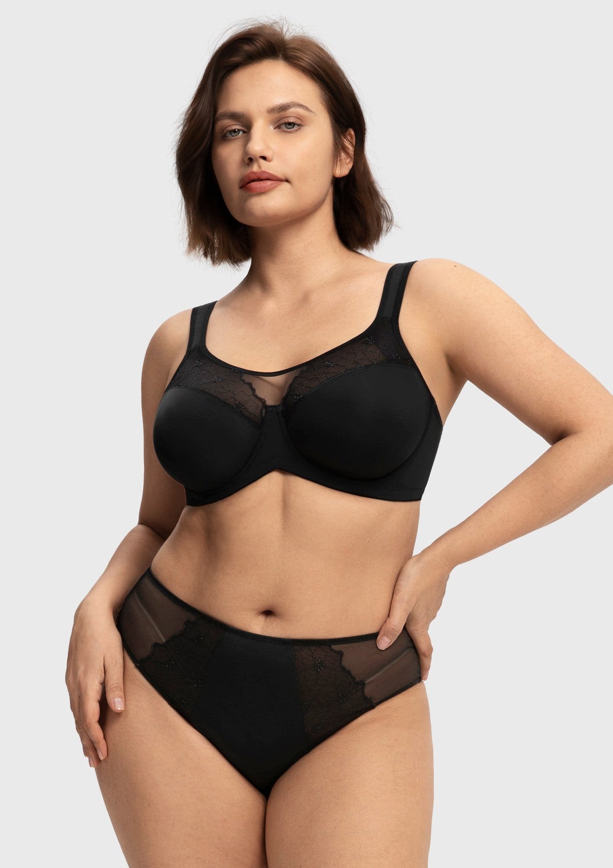 Woman posing confidently in the black spill-free unlined bra, demonstrating ultimate containment without the dreaded quad-boob effect