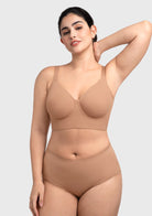 Woman wearing the caramel full coverage underwire bra, enjoying its cloud-like softness and perfect tailored fit