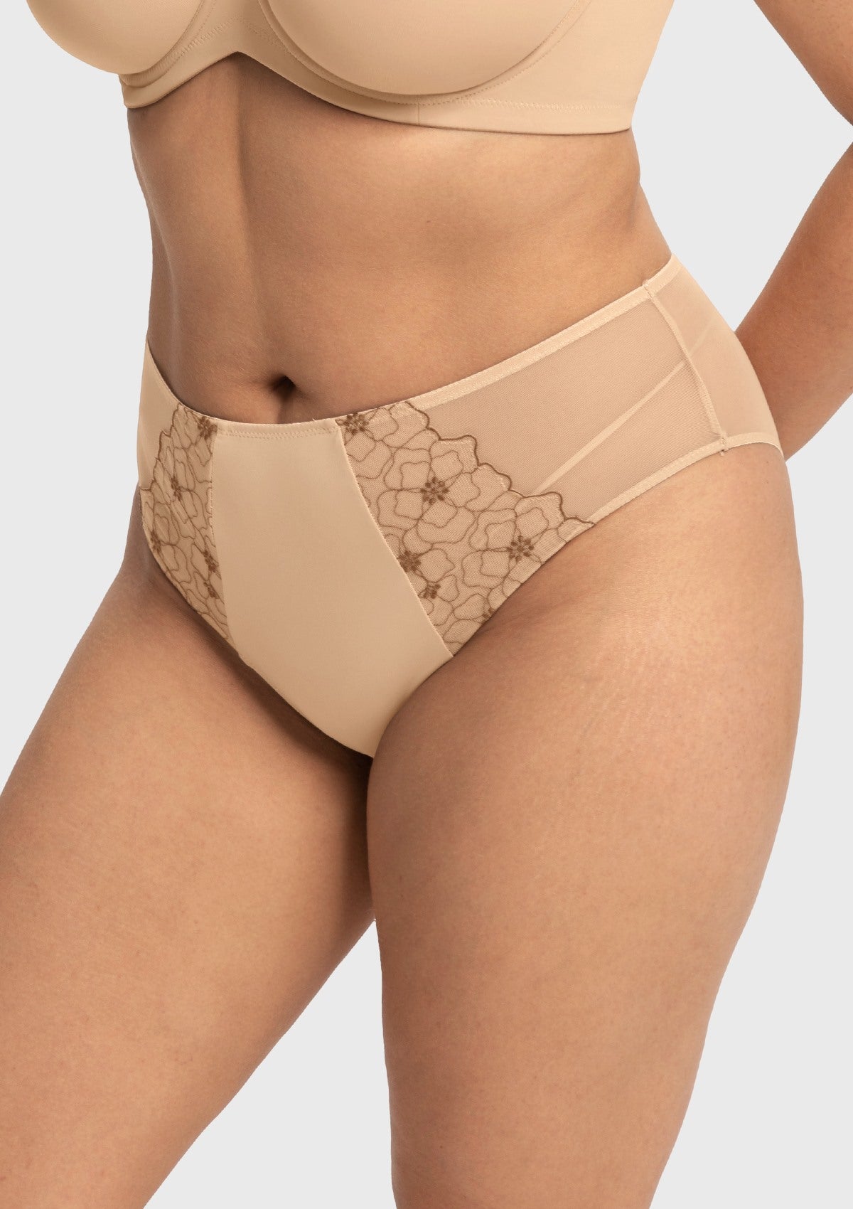 Side angle of the Light Beige high rise panty on model, displaying the seamless edges that ensure a pressure-free and secure fit all day long.