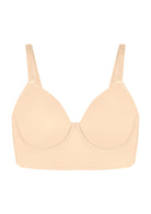 Studio shot of the beige Delia seamless molded cup bra on a white background, detailing the premium two-way stretch fabric.