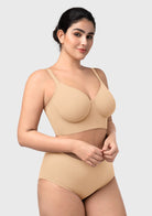 Side profile of the beige seamless longline bra, highlighting the hidden side-slings for a centered, youthful shape.