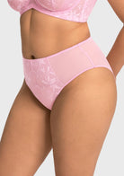 Side profile of model in the soft pink high waist lace panty, showcasing the high-quality elastic waist that never digs in.