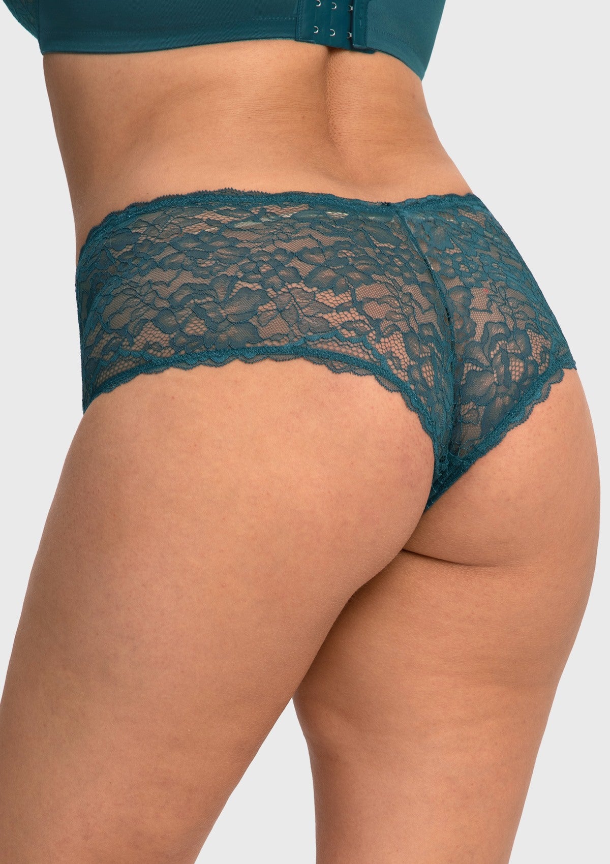 Rear view of model in the balsam blue high waist lace boyshort, showcasing full back coverage that comfortably flatters natural body lines.