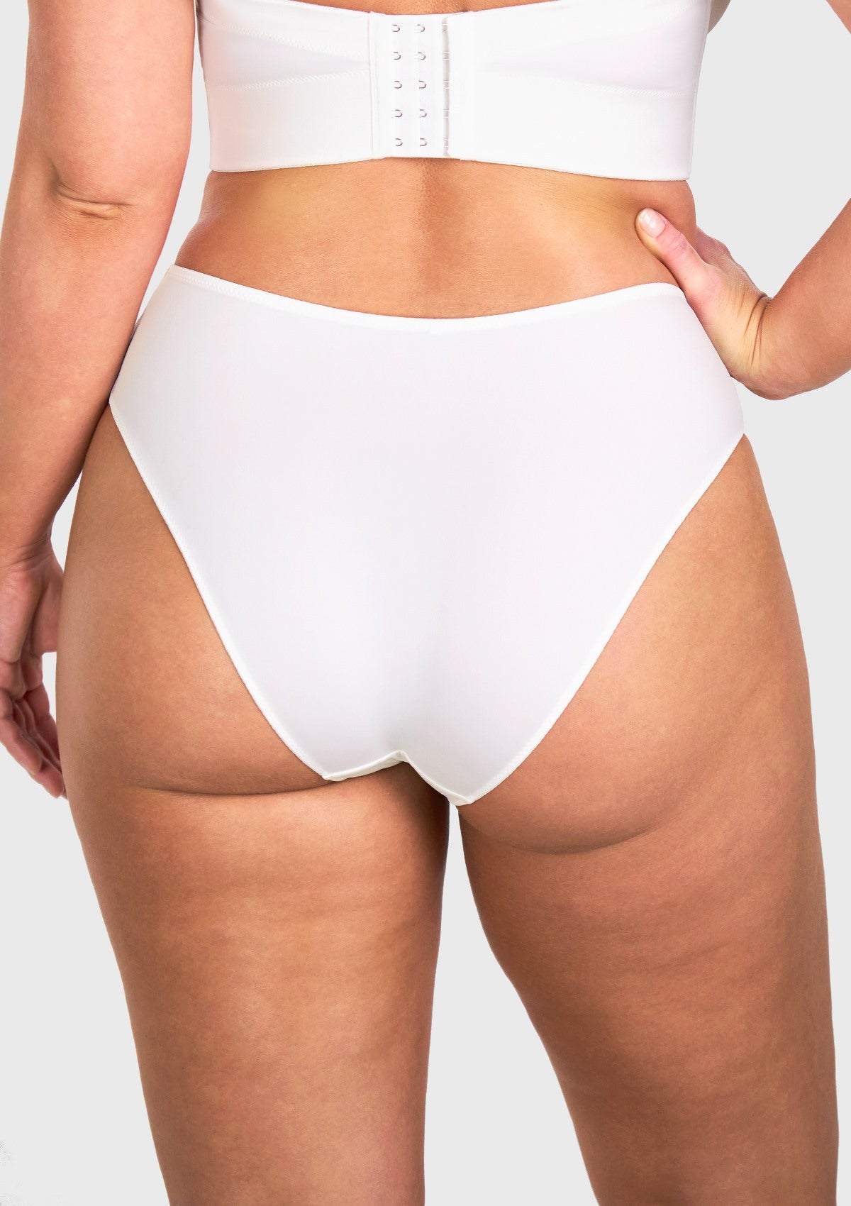 Back view of model in the white seamless underwear no show panties, offering gentle full coverage that beautifully flatters mature curves.