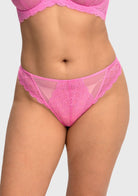 Front view of model wearing the HSIA medium pink women's lace high waist thong panty, featuring a flattering stretch mermaid scale design.