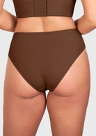Back view of model in the coffee brown high waist seamless underwear, ensuring a secure and flattering fit for changing body shapes.