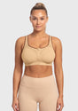  Front view of model wearing the Warm Beige HSIA front closure sports bra, delivering heavy-duty lockdown support and effortless on-and-off convenience.