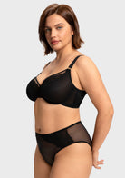Side angle of the black elegant sculpting bra on model, featuring a rigid mesh lining that provides a naturally sculpted shape and forward projection.