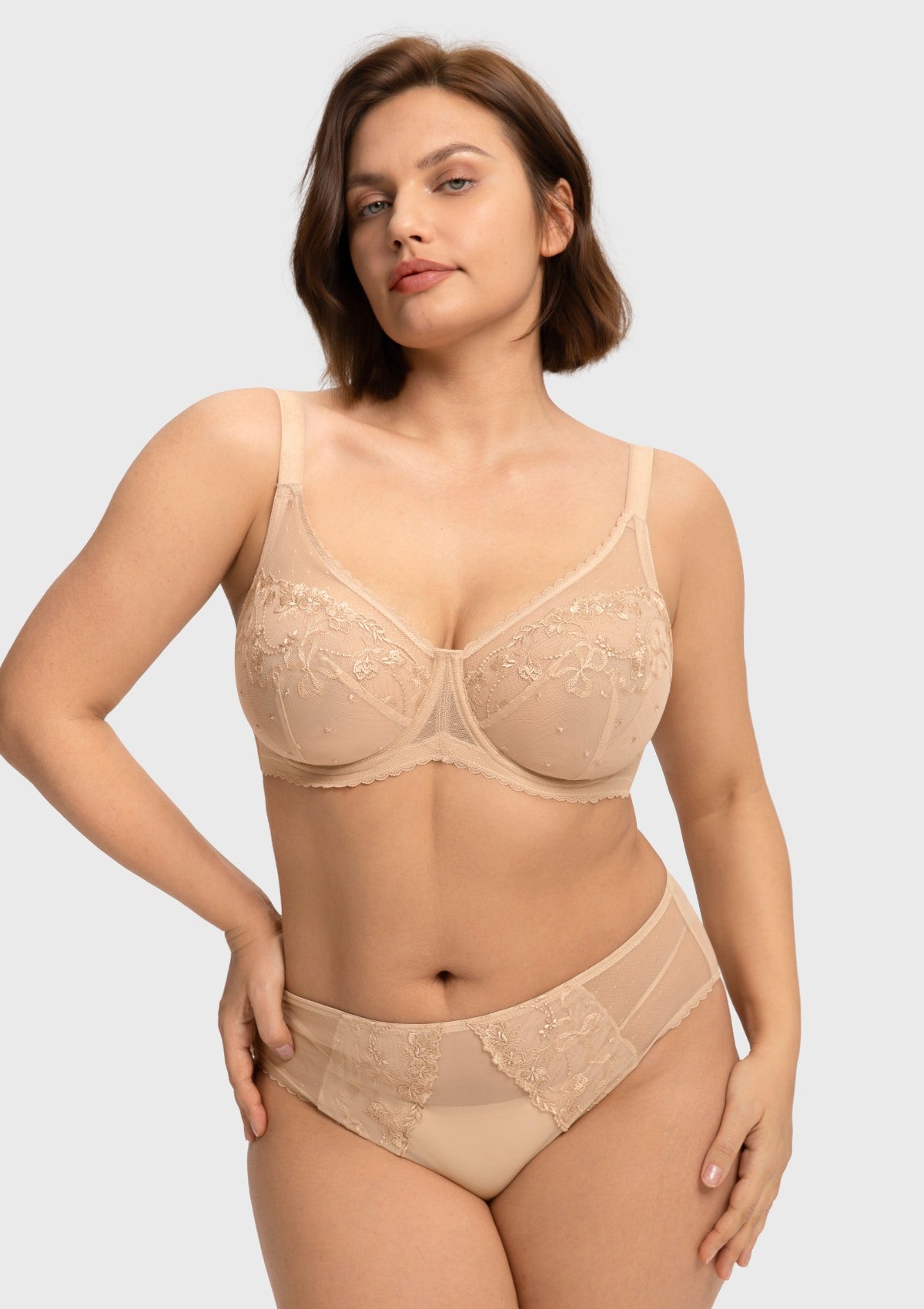 Front view of the light beige embroidered lace full coverage bra, showcasing a spill-free polka-dot neckline designed for heavy breasts.