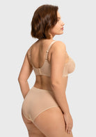 Rear view of the light beige full coverage bra, highlighting the highly breathable power mesh back and zero-pressure straps for all-day comfort.