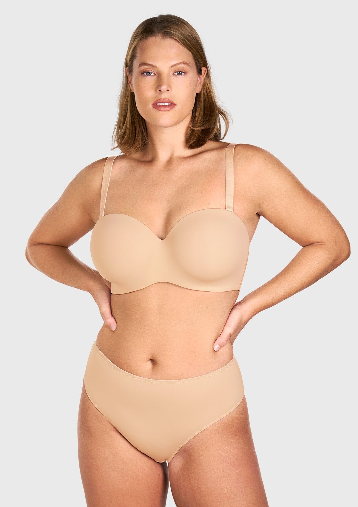 Front view of the black strapless bra worn with convertible straps for daily support
