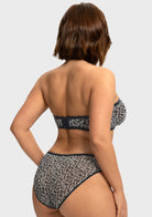 Back view highlighting the silicone no-slip grip of the black and white leopard minimizing bra strapless design