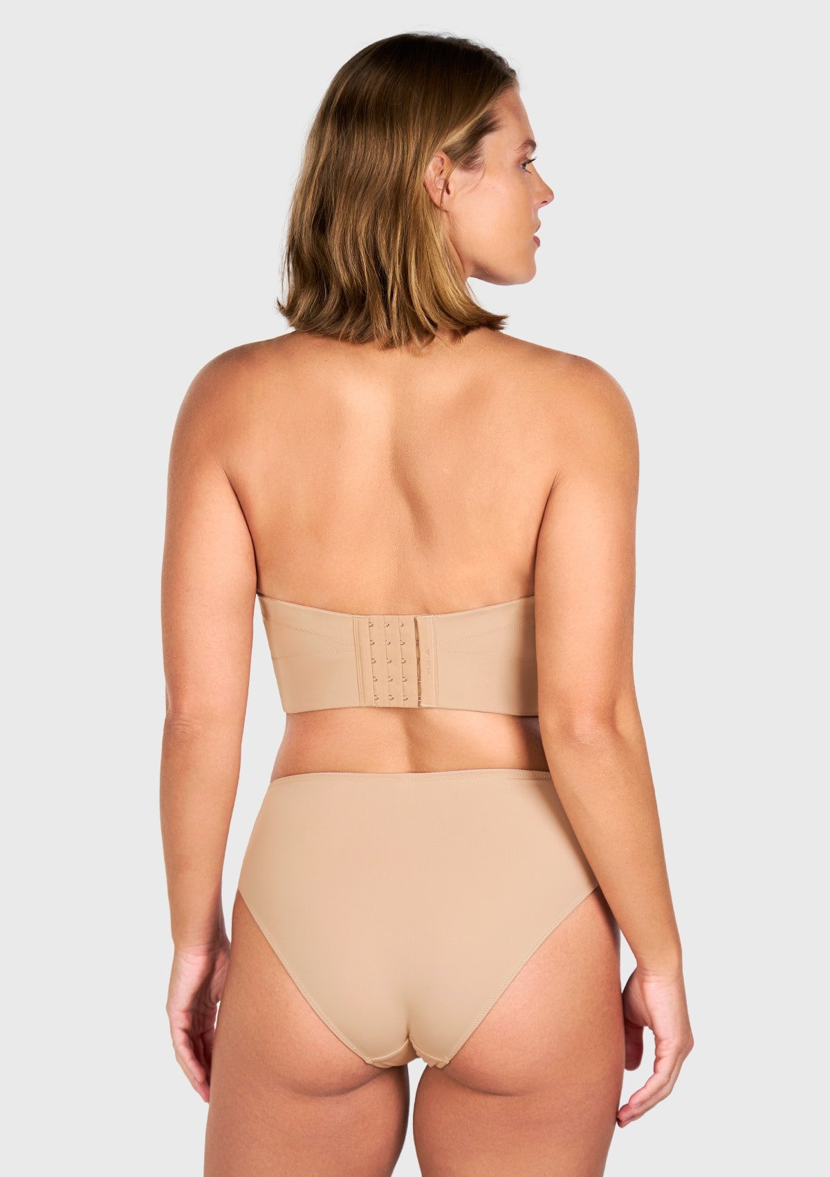 Rear view of the nude back smoothing longline bra, highlighting the secure multi-row hook closure for larger cup sizes.