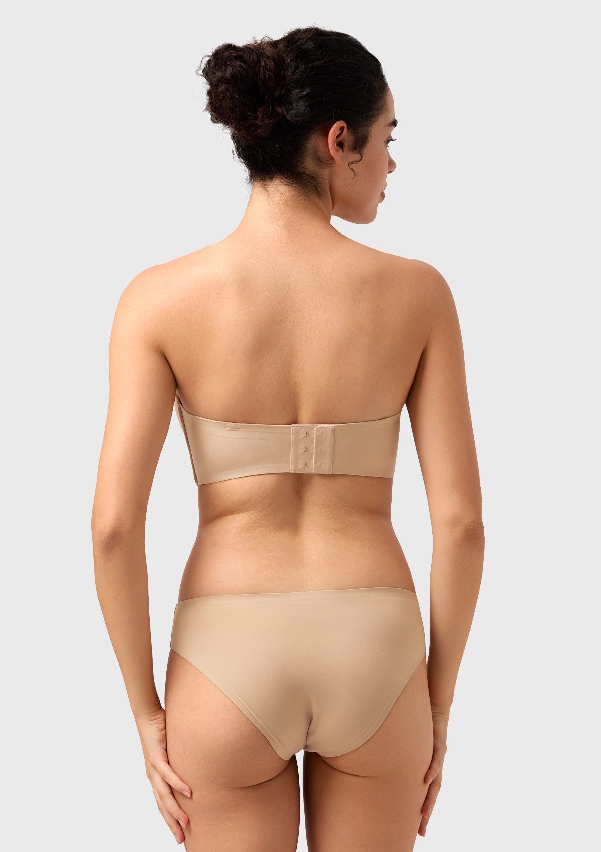 Back view of the nude comfortable wireless bra, highlighting the seamless 4-row hook closure for a flawless, back-smoothing finish.