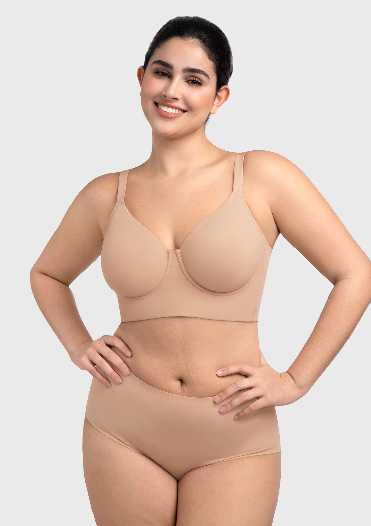 Woman feeling confident in the light nude full coverage minimizer bra that feels like a gentle, everyday hug
