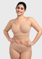 Woman feeling confident in the light nude full coverage minimizer bra that feels like a gentle, everyday hug