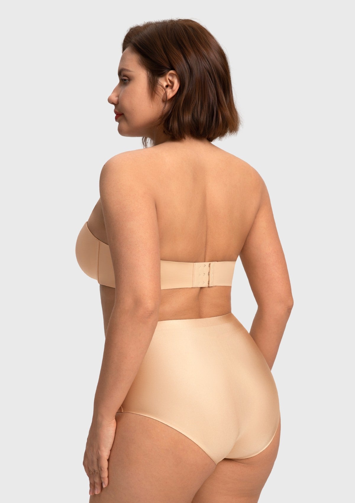 Back view of the nude plus size strapless bra, showcasing the secure multi-row hook closure and seamless, stretch-to-fit wings.