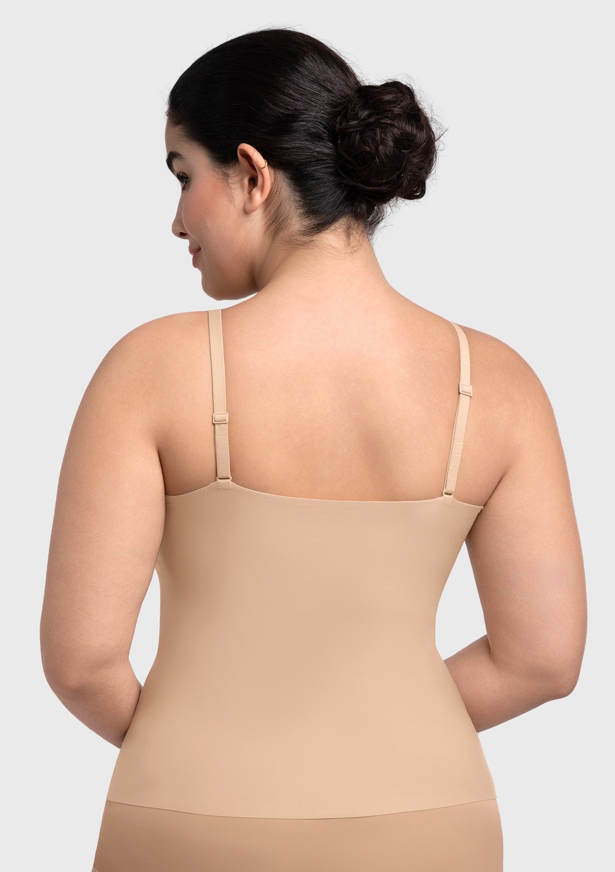 Rear view of the nude wire-free camisole, showing the seamless bonded back that eliminates bulges and visible lines under clothing.
