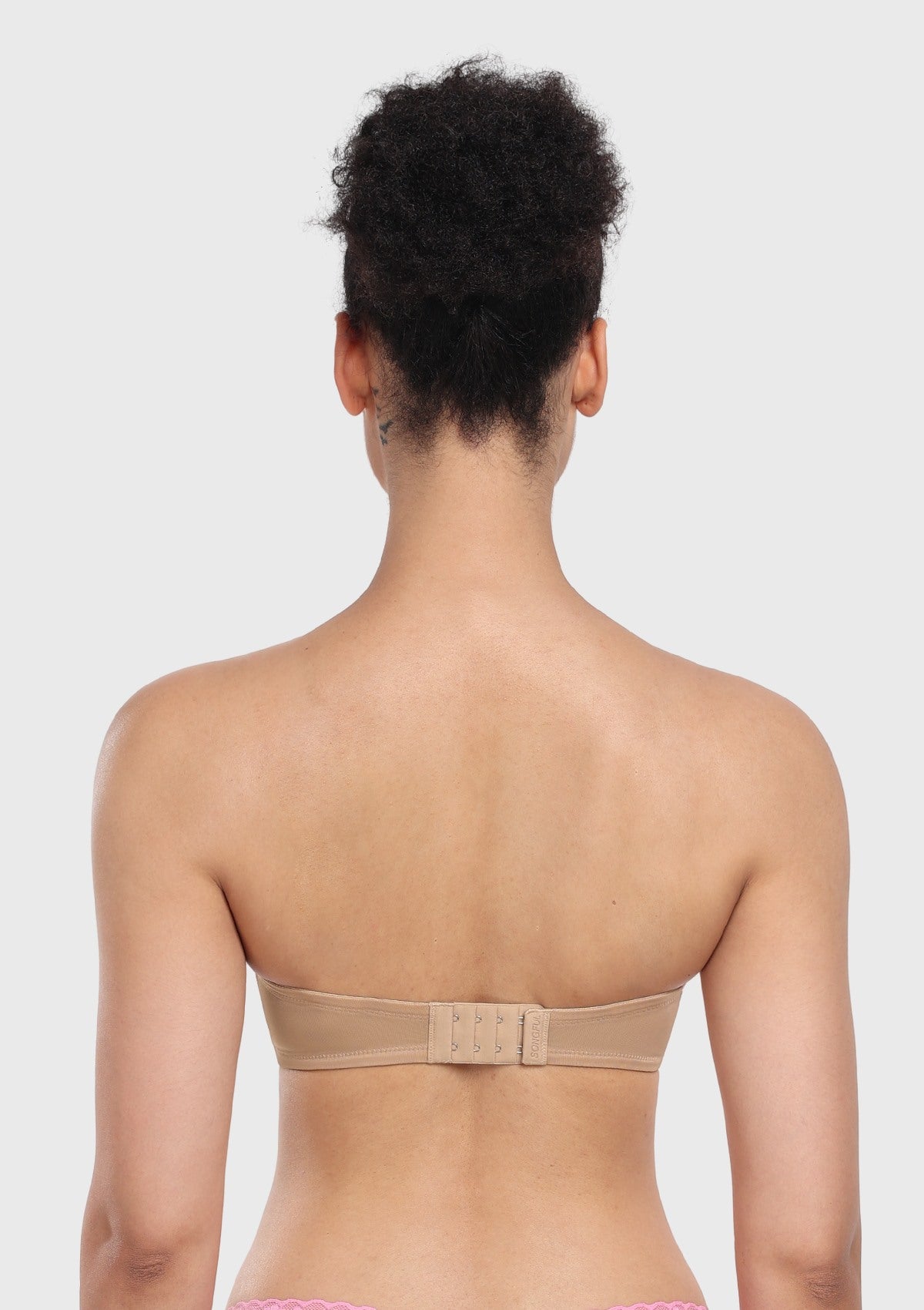 Back view of the nude strapless bra for dresses, featuring a narrow band with breathable stretch mesh perfect for low-cut outfits.